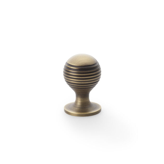 Striped wooden door handle on white background.