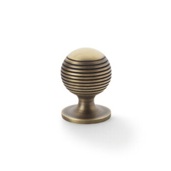 Antique bronze door handle on white background.