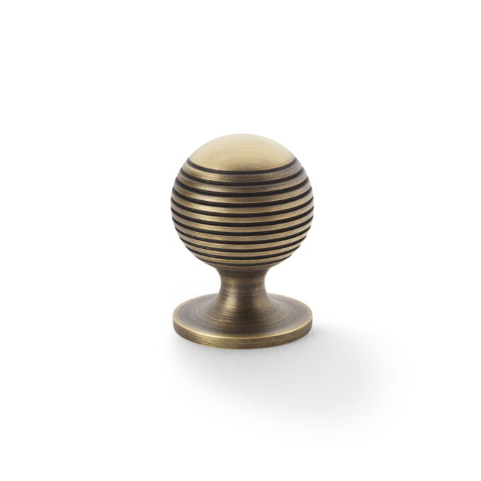 Antique bronze door handle on white background.