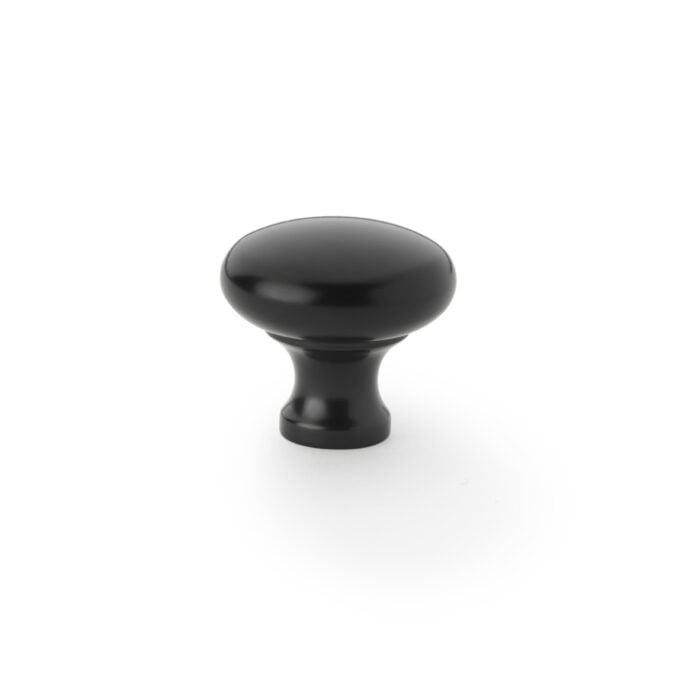 Black cabinet knob on white background.