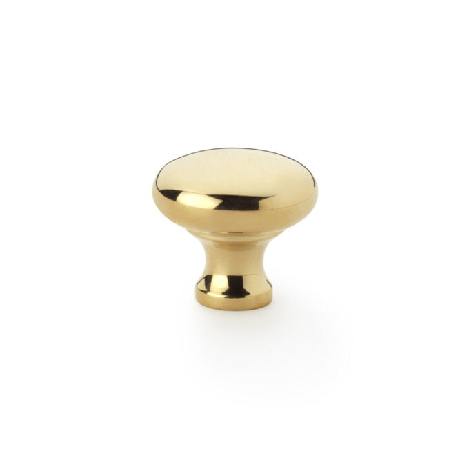 Polished gold cabinet knob on white background.