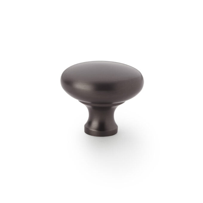 Brown cabinet knob on white background.