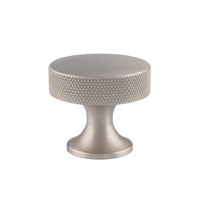 Silver textured knob on white background