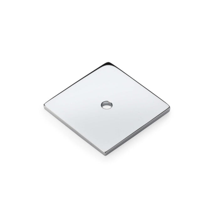 Polished metal square plate with central hole.