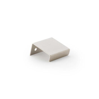 Minimalist stainless steel door stop on white background.