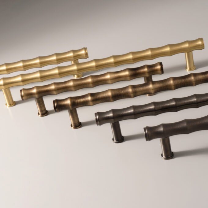 Variety of metal cabinet handles on display.