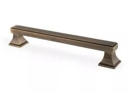 Bronze cabinet handle on white background.