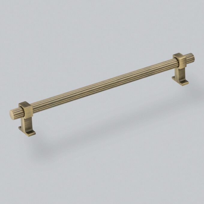 Brass kitchen cabinet handle on white background.