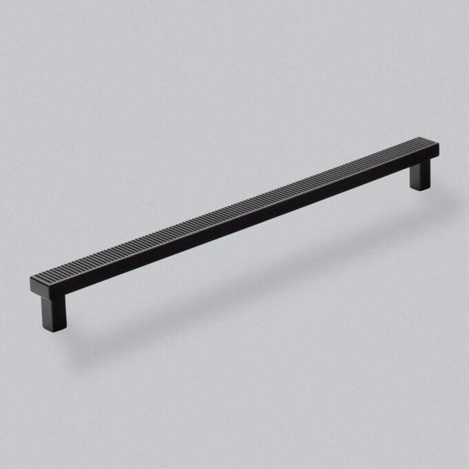 Black textured cabinet handle on a grey background.