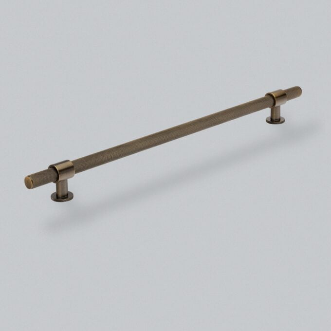 Bronze textured cabinet handle on white background