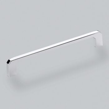 Chrome kitchen cabinet handle on grey background.