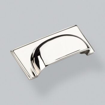 Polished chrome drawer handle on grey background.