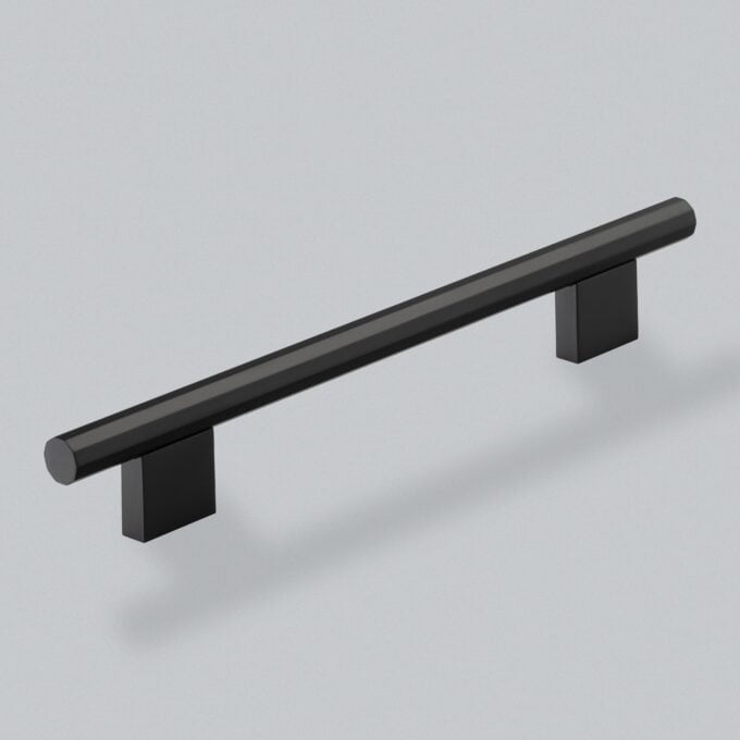 Modern black cabinet handle on a grey background