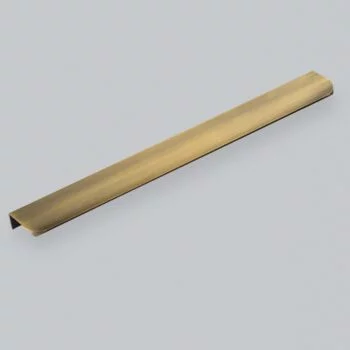 Brass cabinet handle on neutral background.