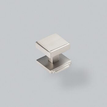 Square silver cabinet knob on grey background.