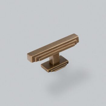 Bronze cabinet handle on grey background