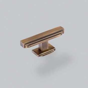 Bronze cabinet handle on grey background