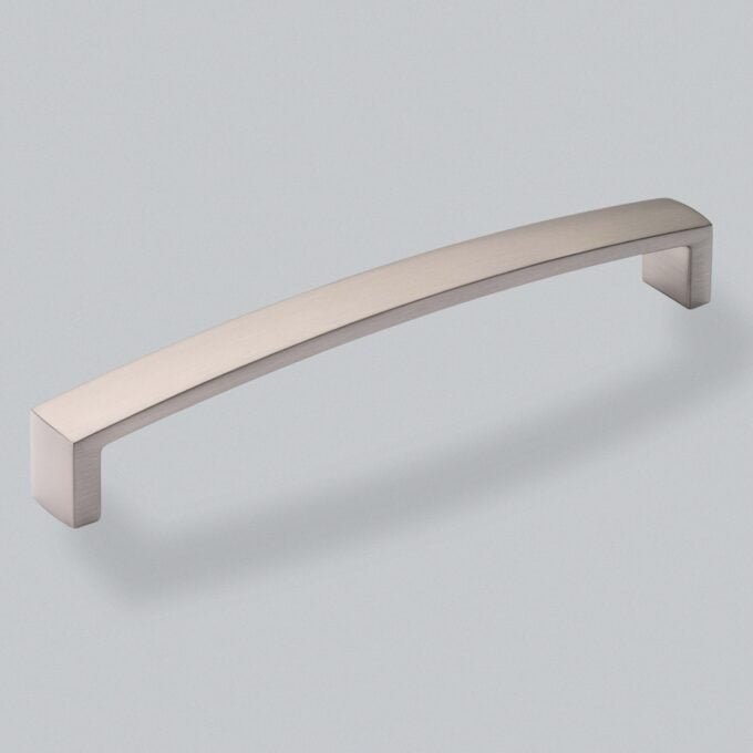 Sleek stainless steel cabinet handle on grey background.