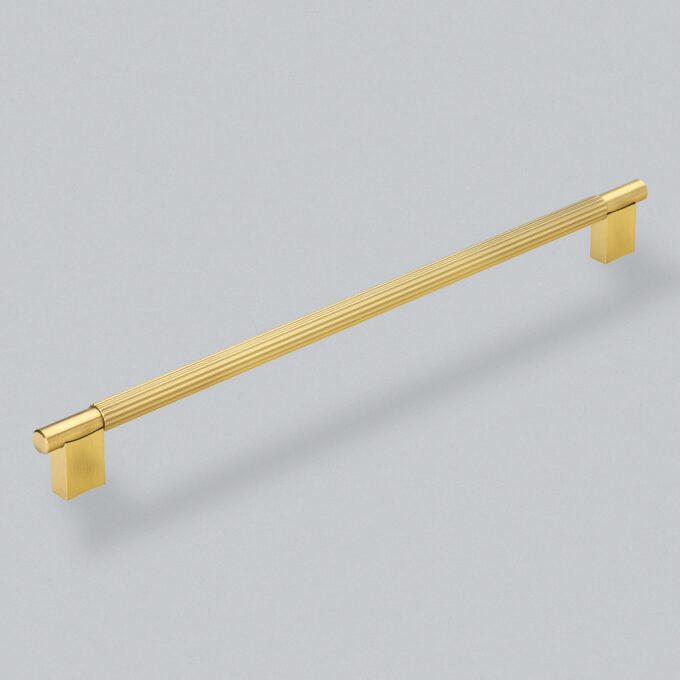 Gold handle with textured grip on grey background.