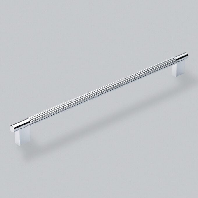 Chrome cabinet handle on grey background.