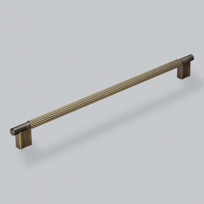 Metal and wood cabinet handle on grey background.