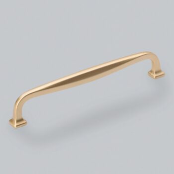 Gold cabinet handle on blue background.