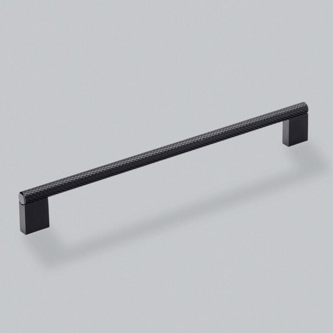 Black textured cabinet handle on grey background.