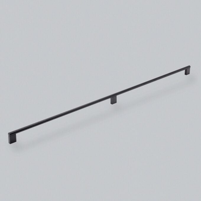 Black minimalist cabinet handle on grey background.