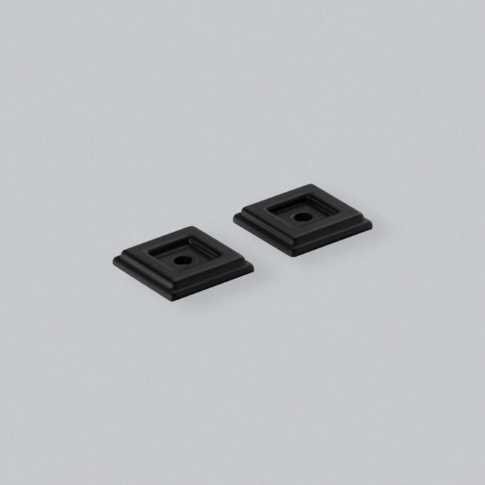 Two black square industrial mounts on grey background.