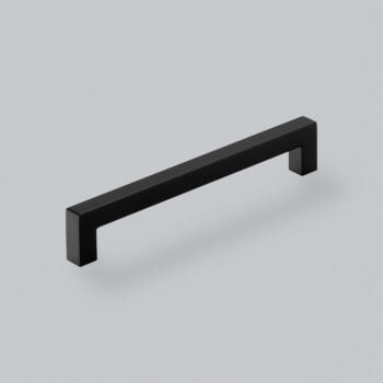 Black modern cabinet handle on a white background