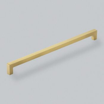 Gold modern cabinet handle on grey background