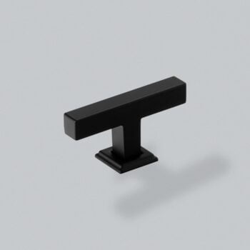 Minimalist black cabinet handle on a grey background