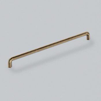 Antique brass cabinet handle on white background.