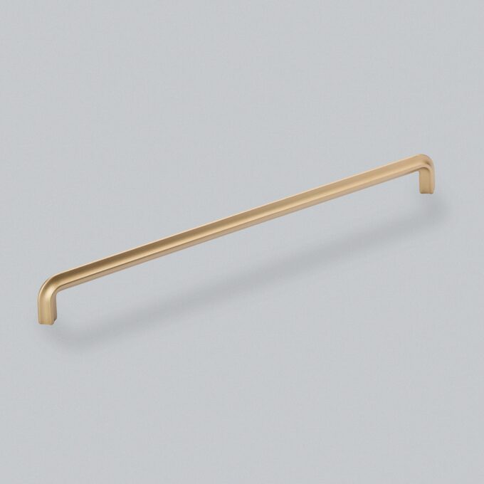 Gold-coloured metal handle on a grey background.