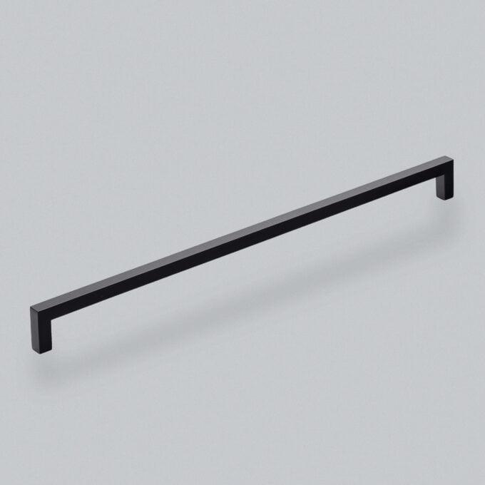 Minimalist black cabinet handle on a grey background.