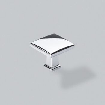 Silver cabinet knob on grey background