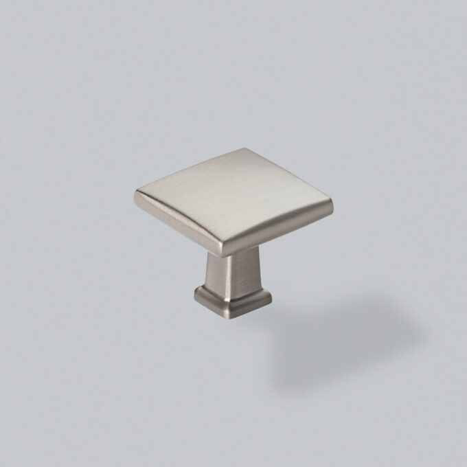 Brushed nickel cabinet knob on white background.