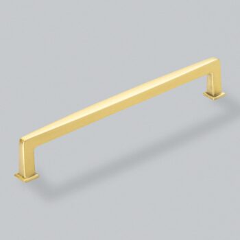 Gold cabinet handle on grey background.