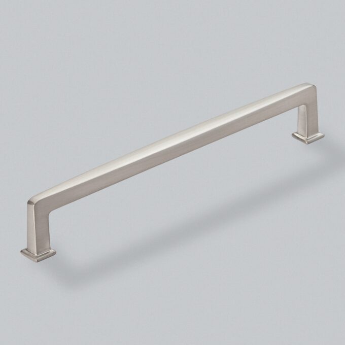 Stainless steel cabinet handle on a grey background.