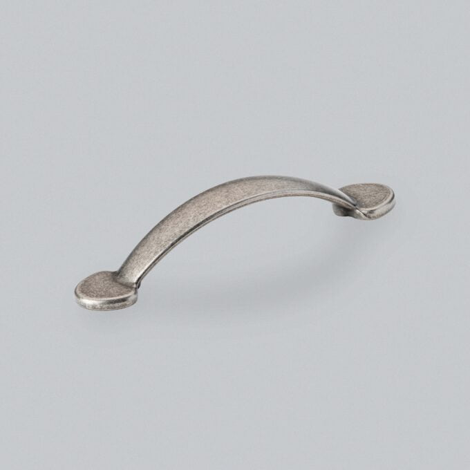 Brushed nickel cabinet handle on a grey background