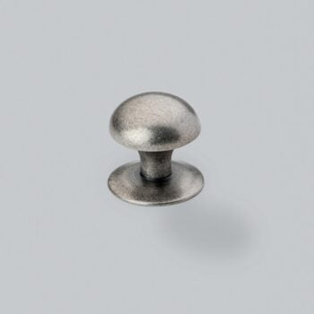 Metal drawer knob on a grey background.