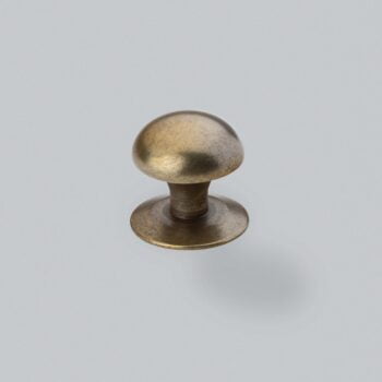 Antique brass drawer knob on white background