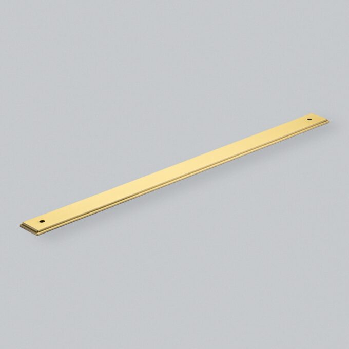 Brass flat bar on grey background