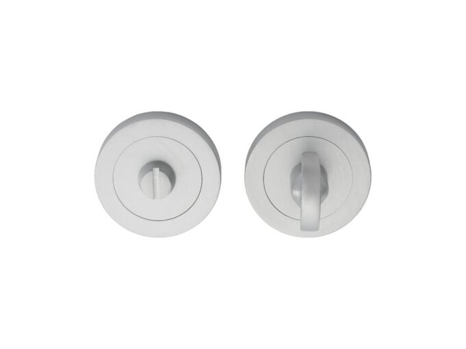 Two modern stainless steel door knobs, top view.