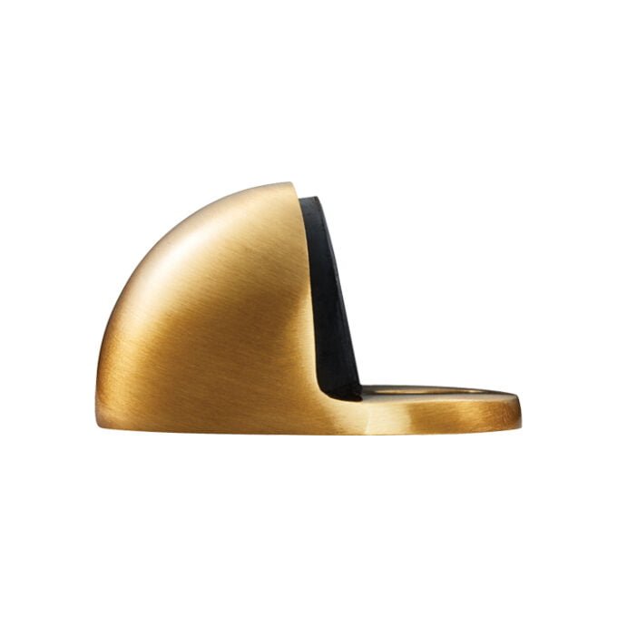 Gold doorstop with sleek modern design on white background.