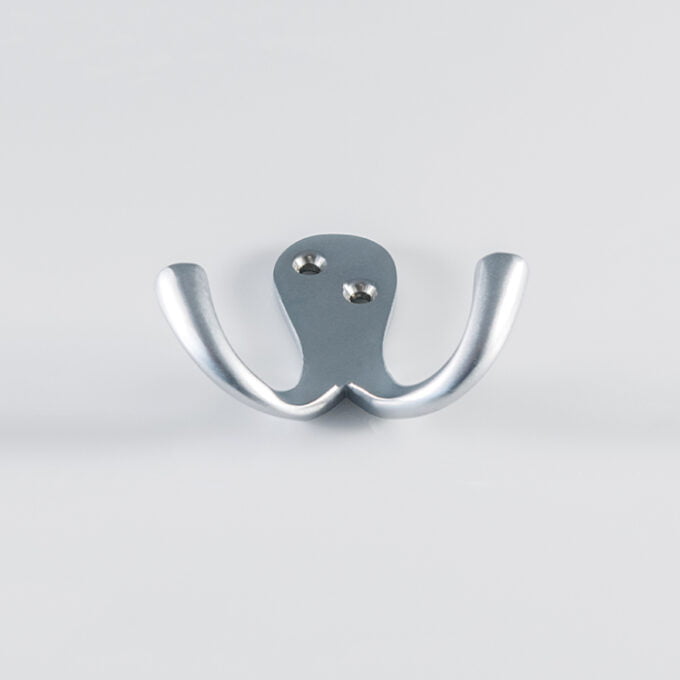 Silver double wall hook on grey background.