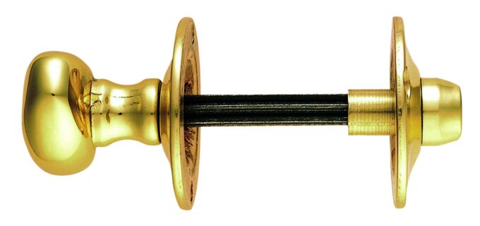 Brass door handle with spindle on white background.