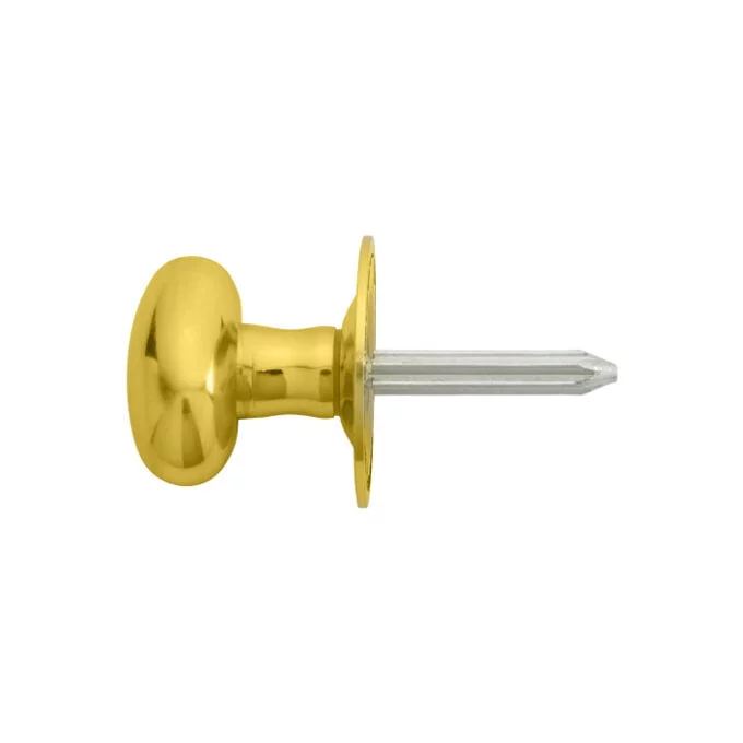 Gold-coloured drawer knob with clear attachment pin.