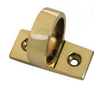 Gold cylindrical door stop mounted on base plate.