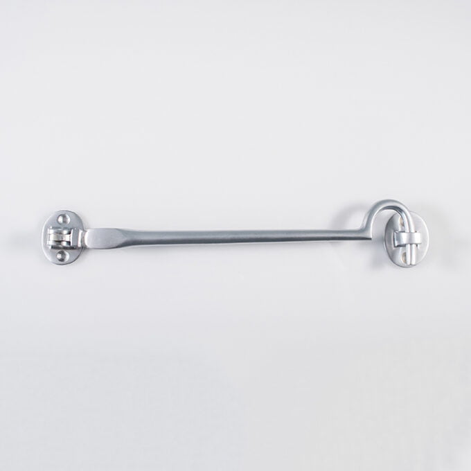 Silver ratchet spanner mounted on white wall